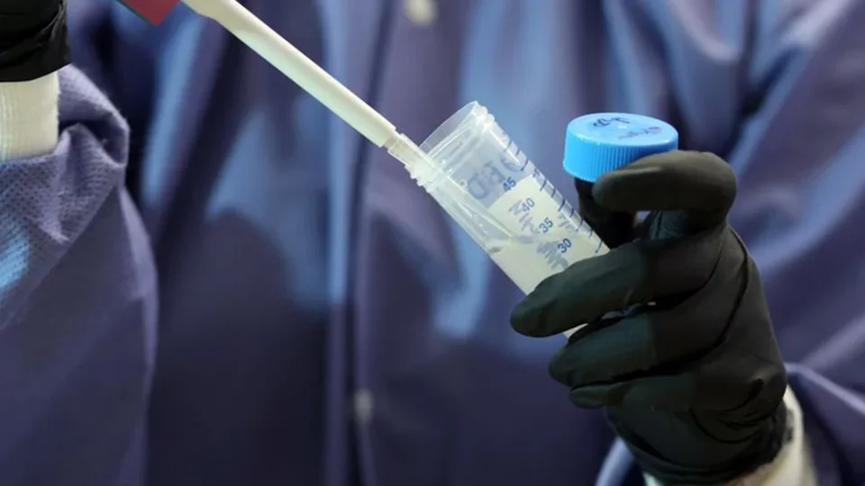 Researcher using pipette