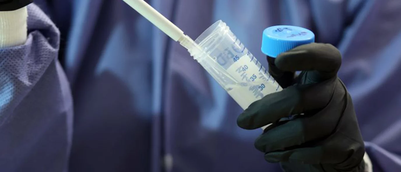 Researcher using pipette